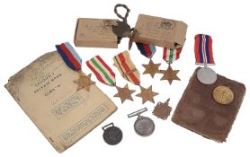 A collection of WWI and WWII medal groups and related items