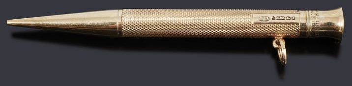 A 9ct gold propelling pencil, with engine turned decoration and a plain polished nib