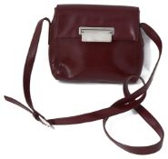 A vintage Prada red leather handbag