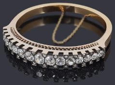 An attractive late 19th Century Swiss 18ct gold diamond hinge bangle