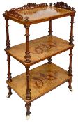A Victorian figured walnut and marquetry inlaid three tier whatnot