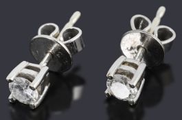 A pair of 9ct white gold diamond stud earrings