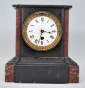 A 19th Century French slate 24 hour mantel clock having a white enamel face with roman numeral