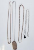 A selection of silver necklaces to include a playboy dog tag necklace on a ball chain, two fancy