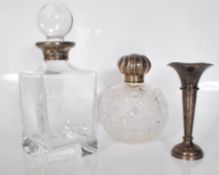 A group of three silver items to include a glass a