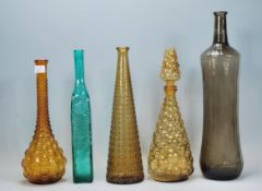 A collection of retro vintage coloured glass bottl