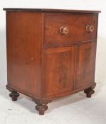 A 19th Century mahogany commode chest formed as a bow front chest, turned handles to the false