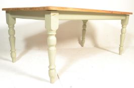 A large 20th Century contemporary pine scrub topped farmhouse dining table, flared top over block