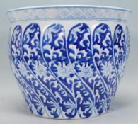 A 20th Century ceramic planter / fish bowl of round waited form having hand painted blue and white
