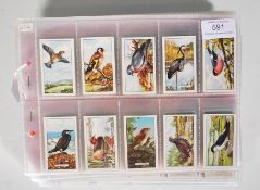 A collection of cigarette cards dating from the early 20th Century, the cards in full sets to