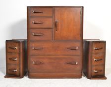 A 1930’s Art Deco oak chest of drawers combination being  raised on a plinth base with bank of 5