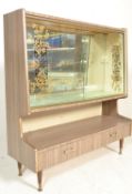 A retro 20th Century mirror back melamine cocktail cabinet fitted with sliding glass printed doors