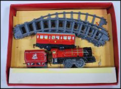 BRIMTOY CLOCKWORK TINPLATE TRAIN SET.