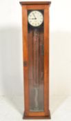 A vintage 20th Century Gents Pul-Syn-Etic Impulse clock, within an oak case having a single glazed