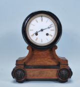 A late 19th Century French walnut cased mantel clock, fitted with barrel movement, the white