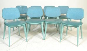 A set of eight retro vintage style butterfly back dining chairs, raised on angular supports with