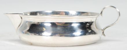 An early 20th Century Edwardian CS Harris and Sons silver hallmarked creamer jug of unusual