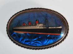 A vintage sterling silver butterfly wing brooch of oval form having the R.M.S Queen Mary to
