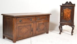 A 1920's end of bed oak low cabinet. Raised on squared legs with double door cupboard beneath 2
