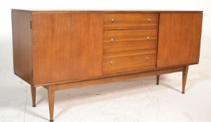 A 1970's retro vintage teak wood sidebaord credenza having a bank of three drawers flanked by two