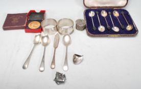 A collection of silver to include a cased set of silver hallmarked coffee bean spoons, Birmingham