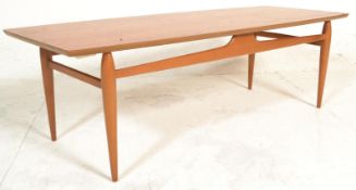 A 1960's retro vintage Danish influence teak wood large coffee table having a surfboard tabletop