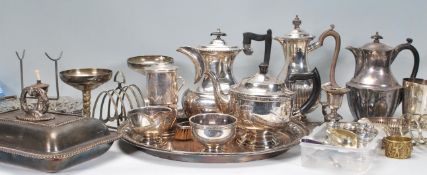 A collection of silverplate items dating from the early 20th Century to include a Walker & Hall