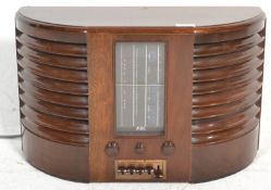 An early 20th Century GEC Art Deco wooden cased valve radio Ca. No B.C 4750, the radio having a