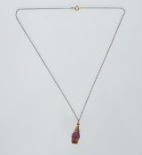 A. Hallmarked 9ct gold and crystal drop pendant strung on a gold plated chain. Hallmarked London.