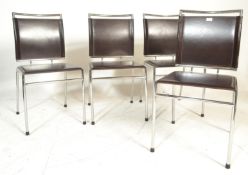 A set of 4 Italian modernist designer chrome and leather dining chairs. Raised on chrome tubular