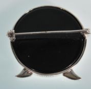 A sterling silver and onyx brooch in the form of two birds. Stamped sterling. Gross weight 12.4g.