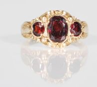 A decorative English hallmarked 9ct gold ladies dress ring having a central oval faceted cut