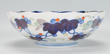 A Chinese blue and white geometric pattern fruit bowl with ironstone red single character mark to