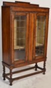 A 1920's oak barley twist shipping oak twin door bookcase / china display cabinet. Raised on