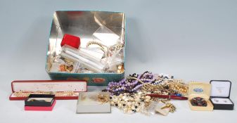 A good collection of vintage and latter costume jewellery to include faux pearl necklaces, rolled