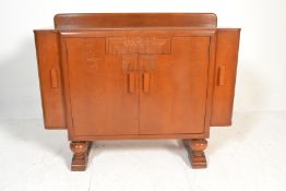 A 1930's Art Deco Ernst Gomme for G Plan oak cocktail cabinet sideboard credenza. The gallery back