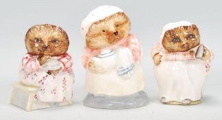 A group of three ceramic Beatrix potter figurines to include Beswick' Mrs Tiggy Winkle' and 'Mrs