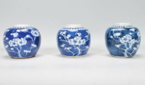 A group of three Chinese blue and white ginger jars of bulbous form and small proportions being hand