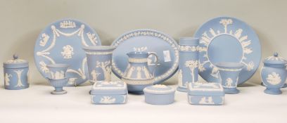 A collection of Wedgwood blue and white jasperware / cameo ceramics to include vases, jug, trinket