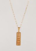 A 9ct yellow gold ingot pendant on a 9ct gold link chain necklace. Ingot Hallmarked 375 for