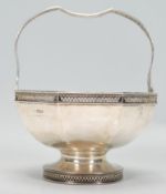An Antique Edwardian hallmarked Sterling Silver Bonbon Dish with pierced base, rim & handle.