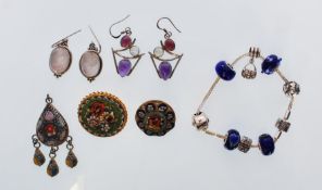 A Rhona Sutton charm bracelet with numerous charms and roundels together with 2 pairs of silver