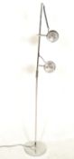 A retro 20th Century vintage floor standing standard lamp having twin black colour spot lights on