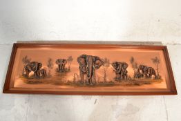 A large mid century African copper panel in relief depicting elephants on the plain bearing