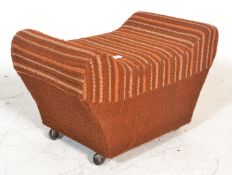 A retro vintage 20th Century pouffe / dressing table stool of saddle form upholstered in a woollen