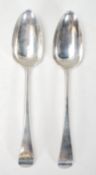 A pair of early 19th Century George III Alice and George Burrows silver hallmarked serving spoons