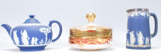 A 19th Century Victorian jasperware tea pot having a cobalt ground with raised white classical