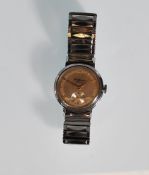 A vintage gentleman's J W Benson wrist watch having a champagne dial with gilt roman numeral chapter