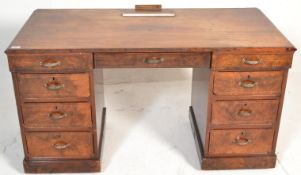A Victorian walnut 19th century walnut inlaid twin pedestal writing desk. Each pedestal raised on