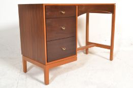 A 20th Century retro vintage Stag teak wood single pedestal dressing table having a bank of three